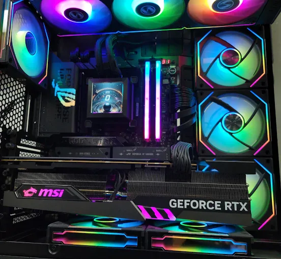 RGB custom gaming PC with ASUS ROG motherboard, MSI GeForce RTX graphics card, and Lian Li fans